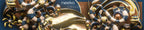 A close-up of an ornate metallic decorative object with swirling gold, silver, and dark blue patterns, plus the visible text 'neeko' and 'releav kit' near the top center.